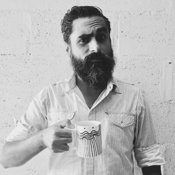 Vicente David Gutiérrez holding a coffee cup